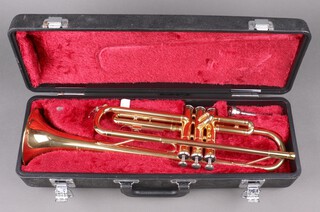 A Yamaha brass trumpet (1 valve jammed), complete with carrying case 