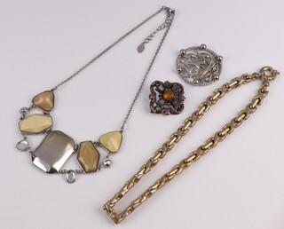 A Victorian Celtic style silver brooch set polished hardstones, together with a small collection of costume jewellery 