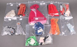 Eleven complete Barbie outfits, dating from 1959-1965, including American Airlines Stewardess No. 984, Career Girl No. 954, Ballerina No. 989, Sophisticated Lady No. 993 (necklace discoloured), Theatre Date No. 959, Dinner at Eight No. 946, Red Flare No.939, Golden Elegance No. 992 (jewellery needs repair), Floral Petticoat No. 921, Cotton Casual No. 912 & Undergarments No. 919 together with a bag of additional Barbie clothing including blue Sheath Dress with "Gold" buttons 1962-1963), a white Silk Sheath dress (1962-1963), a red Helenca swimsuit (1962-1963 - no accessories), red Slacks with yellow belt (1962-1963), an orange Belle dress (1962-1963), a pink square neck sweater (1962-1963), black and white slacks with red belt (1962-1963)
