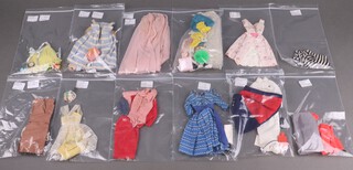 Twelve early Barbie outfits (incomplete), dating from 1959-1964, including two original swimsuits (glasses af), Sweet Dreams, No. 973 (missing pom poms to slippers), Sweater Girl No. 976 (missing knitting accessories), Garden party No. 931 (shoes split), Orange Blossom No. 987 (missing ribbons to bouquet), an early version of Suburban Shopper No. 969 (missing necklace but the telephone has a metal dial), Registered Nurse No. 991 (missing spoon),Let's Dance No. 978 (missing earrings), Busy Gal No. 981 (missing belt, shoes and portfolio), Sorority Meeting No. 937 (missing earrings and one shoe), Nighty Negligee Set No. 965 (missing pom poms from slippers) together with a bag of accessories and non Barbie items