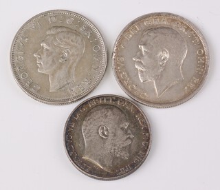 A 1902 Edward VII silver florin (standing Britannia) together with a 1915 George V half crown and a 1945 George VI half crown 