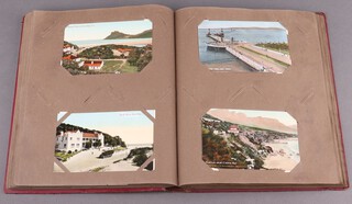 An early 19th Century postcard album depicting South African landscapes, buildings, botanical specimens and social scenes 
