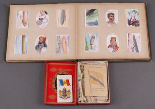 A collection of loose detached Kensitas silks in a Silk Cut box, together with an incomplete album of cigarette cards, mainly 1930's onwards 