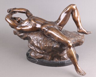 A 20th Century bronze figure of a reclining naked gentleman 36cm x 58cm x 20cm on a marble base 
