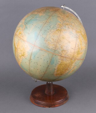 A 1950's Phillips 13 1/2" terrestrial globe raised on a wooden stand  