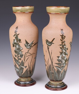 A pair of Doulton Lambeth Florence Elizabeth Barlow pate-sur-pate vases decorated birds amongst fox gloves, the bases impressed Doulton Lambeth 936 rg and incised FEB, 43cm   