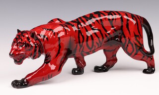 A Royal Doulton flambe figure of a walking tiger 14cm x 35cm, base marked Royal Doulton 