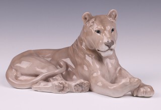 A Royal Copenhagen figure of a seated lioness, base marked 804 65, 16cm x 32cm 