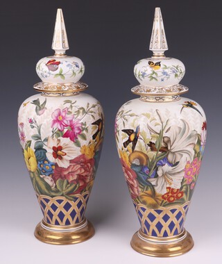 An impressive pair of 20th Century Sevres style porcelain urns and covers decorated birds amidst branches 50cm h x 18cm 