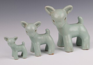 Three unmarked Denby turquoise glazed figures of standing lambs 18cm, 11cm and 7cm 