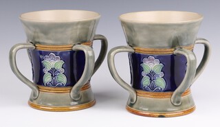 A pair of Royal Doulton blue and turquoise salt glazed 4 handled tygs circa 1918, bases impressed Royal Doulton 8126 and incised MB for Maud Bowden, 15cm 