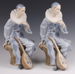 Nao, two figures of seated Pierrot with mandolin, base impressed A9E 34cm 