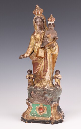 A 19th Century Continental pottery figure of standing Virgin Mary with infant Christ and attendants 34cm 