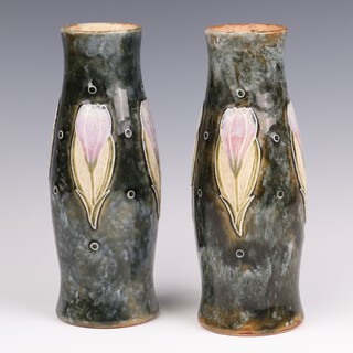 A pair of Royal Doulton Art Nouveau green salt glazed vases decorated tulips, bases impressed Royal Doulton 8546 and incised MB for Maud Bowden 20cm 