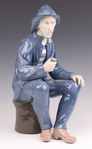 A Nao figure of a seated sailor, base impressed B-3JU 39cm 