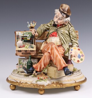 A Capodimonte figure of a seated artist 27cm, the base signed L Serafin