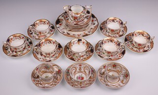 A 19th Century Rockingham 21 piece Imari pattern tea service, the reverse marked 561 and with Rockingham griffin mark, comprising bread plate (cracked), 7 cups (6 cracked), 12 saucers (9 cracked) and 6 19th Century tea cups and saucers, the bases marked CB320 