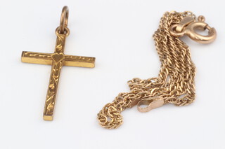 A 9ct yellow gold cross together with a 9ct yellow gold bracelet 18cm, 1.63 grams 