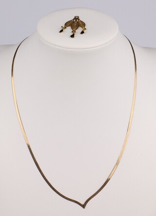 A yellow gold, testing as 9ct necklace, 1.73 grams together with a gold testing as 9ct yellow gold  pierced leaf shape earring 0.69 grams 