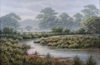 Terrence Grundy (British, b.1956) "River Meadows with Cattle grazing", oil on canvas, 49cm x 74cm, within a gilt composition frame.