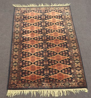 A black and brown ground Belouche rug with 18 stylised diamonds to the centre 167cm x 97cm 