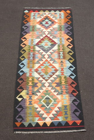 A black, white and purple ground Maimana Kilim runner with diamond design 198cm x 66cm 