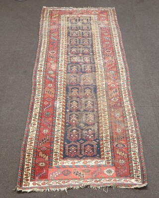 A brown, blue and white ground Caucasian style runner with a multi row border (in wear) 