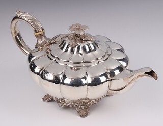 A William IV silver teapot of melon form with ivory resistors, on panelled supports, engraved monogram, maker John, Henry and Charles Lias, London 1834, gross weight 650 grams Ivory Exemption Certificate S5TY2X2G