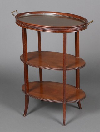 An Edwardian oval mahogany 3 tier etagere, the top fitted a glass bottomed twin handled tea tray, raised on outswept supports 78cm h x 65cm w x 63cm d 