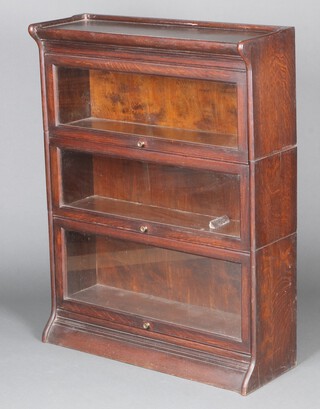 A Gumm oak 3 tier Globe Wernicke style bookcase enclosed by glazed panelled doors 112cm h x 86cm w x 30cm 