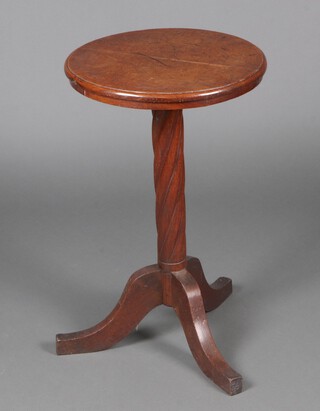A 19th Century circular oak wine table, raised on a spiral turned column and tripod case 72cm h x 45cm diam. 