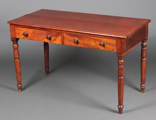 A Victorian mahogany writing table fitted 2 drawers, raised on turned supports 73cm h x 123cm w x 61cm d 