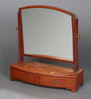 A 19th Century arched plate dressing table mirror contained in a mahogany crossbanded frame, the bow front base fitted 2 drawers, raised on bracket feet 63cm h x 58cm w x 20cm d 
