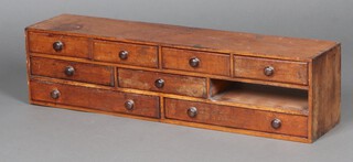 A Victorian mahogany table top chest of 4 short and 4 long drawers with turned handles 23cm x 92cm w x 20cm d 