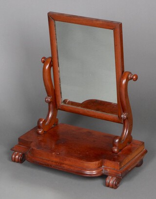 A Victorian rectangular plate dressing table mirror, contained in a mahogany frame, the serpentine base raised on scrolled supports 68cm h x 59cm w x 32cm d 