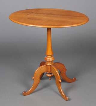 A Victorian oval bleached mahogany wine table on a turned column and tripod base 72cm h x 51cm w x 48cm d 