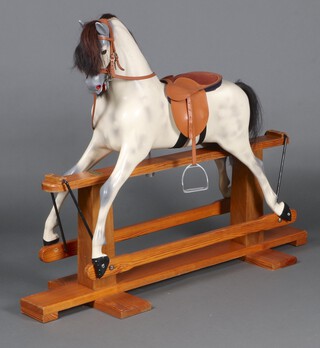 Haddon Rockers, a 20th Century dapple grey rocking horse on a pine cruciform frame 105cm h x 137 l x 44cm d  
