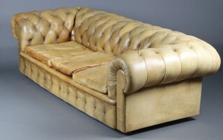 A 3 seat Chesterfield upholstered in bleached green buttoned leather, 66cm h x 230cm w x 97cm d (seat 163cm x 55cm) 