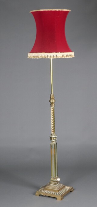 A brass adjustable standard lamp, raised on square stepped base 150cm h x 30cm 