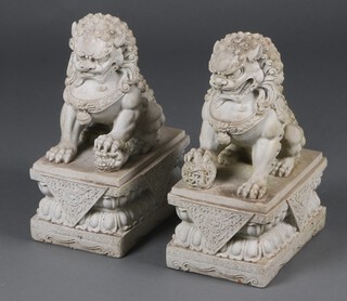 A pair of 20th Century composition figures of seated Dogs of Fo, raised on rectangular bases 43cm h x 20cm w x 30cm d 