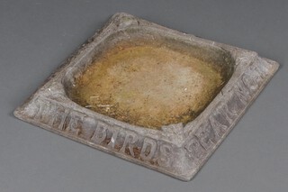 A square cast iron bird bath marked "Fear Not to Show Because of The Birds", the corners with owl mask decoration  8cm h  x 50cm w x 49cm d