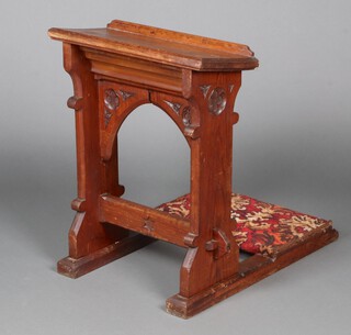 A Victorian Gothic pitch pine prie dieu, 75cm h x 77cm w x 51cm d 