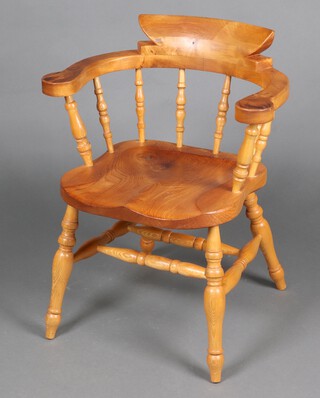 Robert J Elliott of Warnham, of local interest, a 20th Century  ash and elm smokers bow chair with solid seat, the base signed RE 