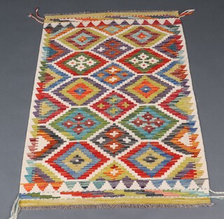 A green, white and blue ground Kilim Chobi rug with all over diamond design 124cm x 80cm 
