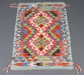 A white, green and blue ground Chobi Kilim rug with 2 diamonds to the centre 101cm x 62cm 