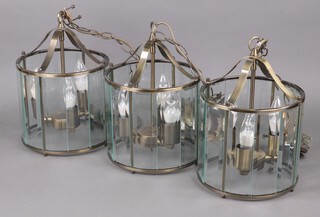 Three circular gilt metal and glass 3 light hanging lanterns 36cm h x 24cm diam. 