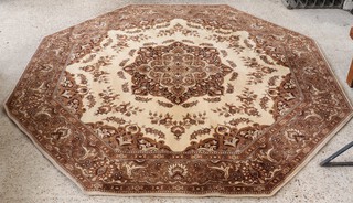 A 1970/80's octagonal brown and white ground floral patterned machine made rug 242cm x 249cm 
