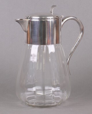 A glass lemonade jug with silver plated mounts and liner 28cm 
