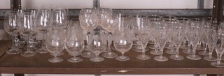 Six long stemmed hock wine glasses, 4 glass rummers, a suite of trumpet shaped wine glasses and a collection of brandy balloons
