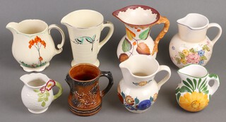 An Ivory Pottery Art Deco jug together with 7 other jugs  